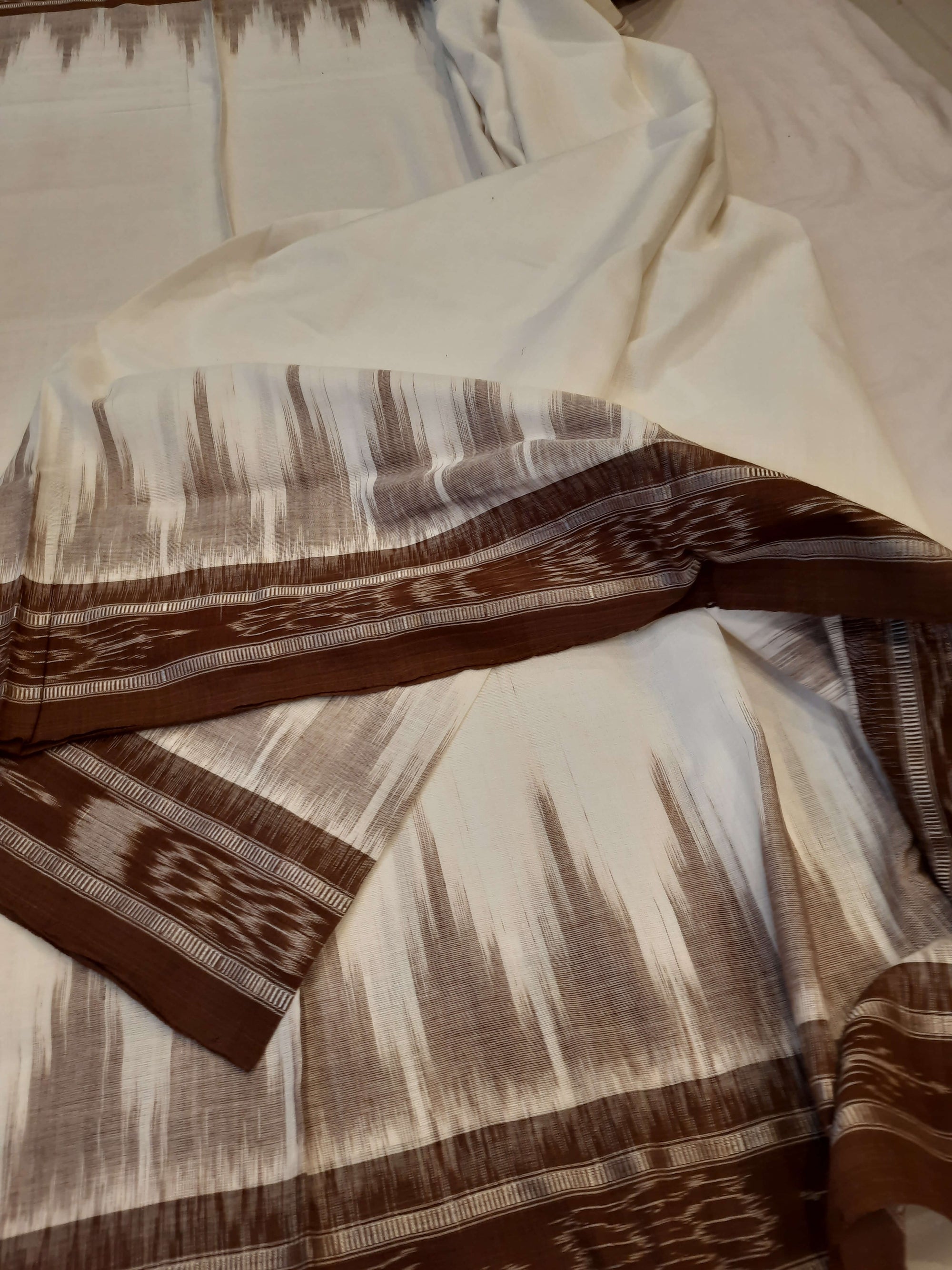 White and Brown coloured Odisha Ikat saree  with cotton ikat blouse piece