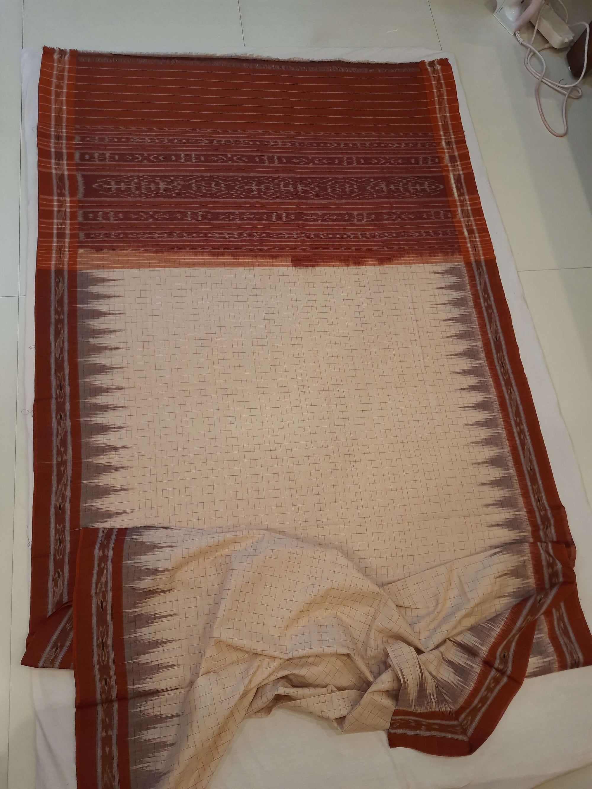 Beige and Rust Cotton Odisha Ikat saree with mix match cotton blouse piece