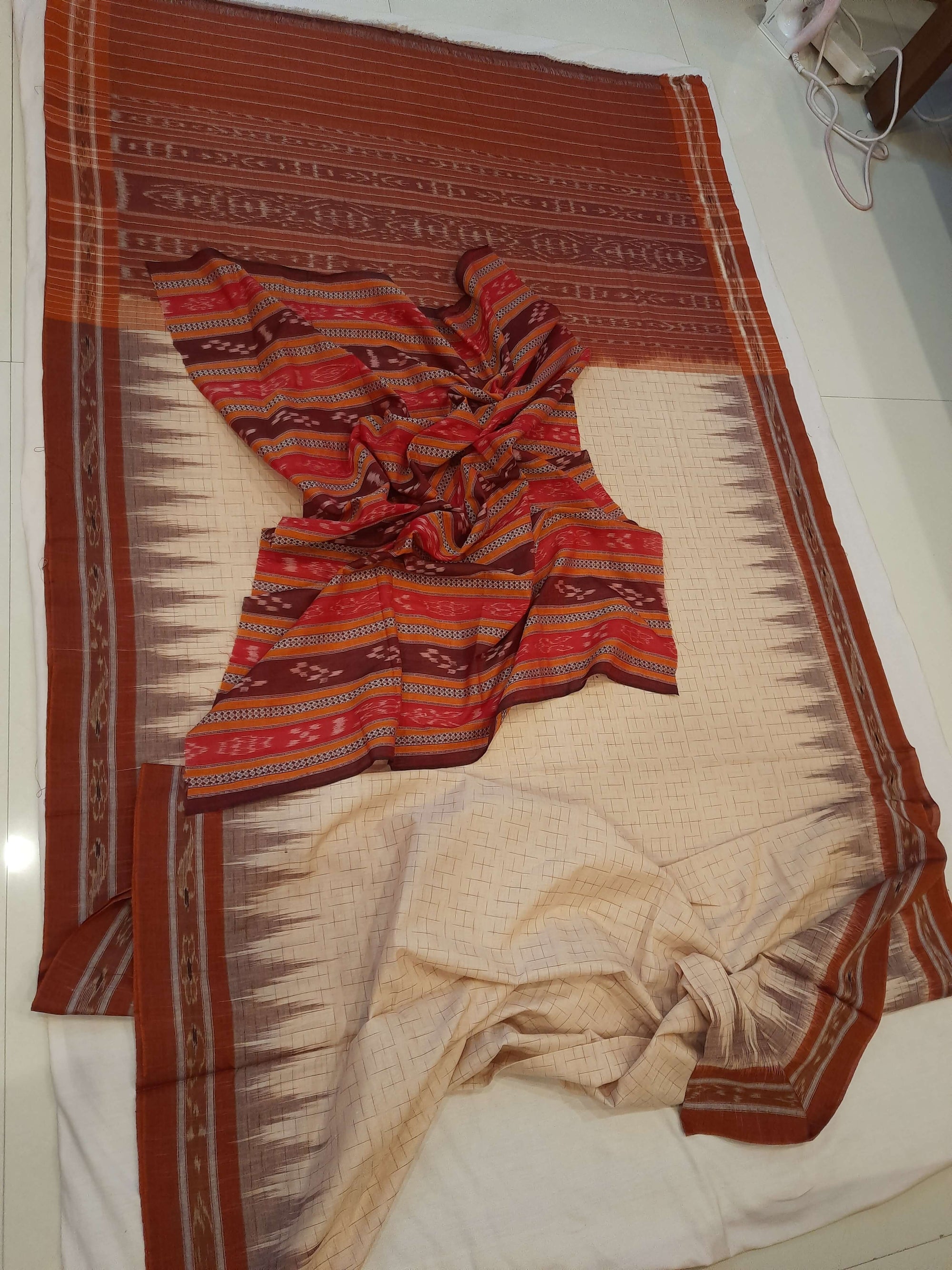 Beige and Rust Cotton Odisha Ikat saree with mix match cotton blouse piece