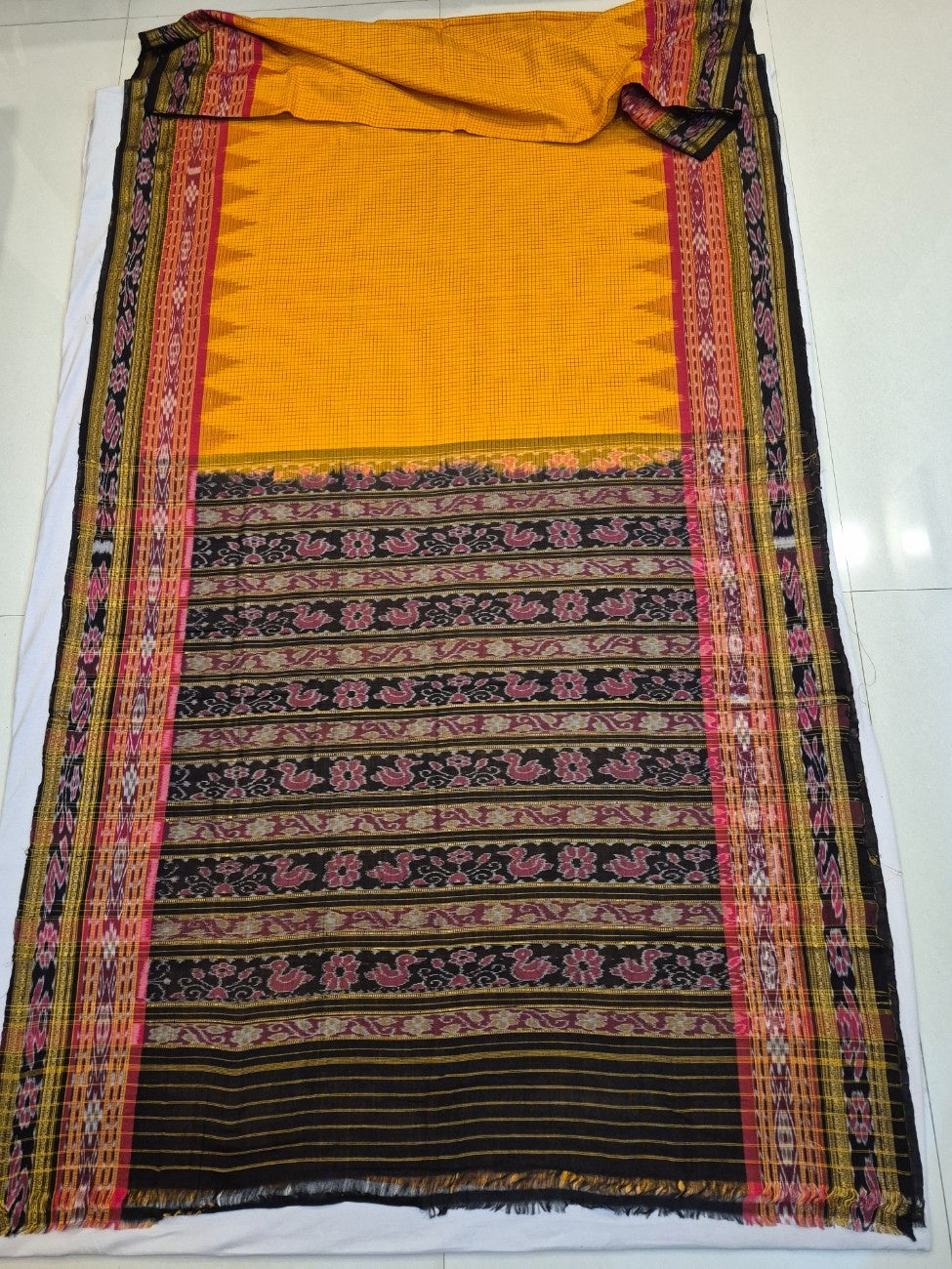Yellow double order Sachipar Nuapatna Cotton Ikat saree with cotton ikat blouse piece