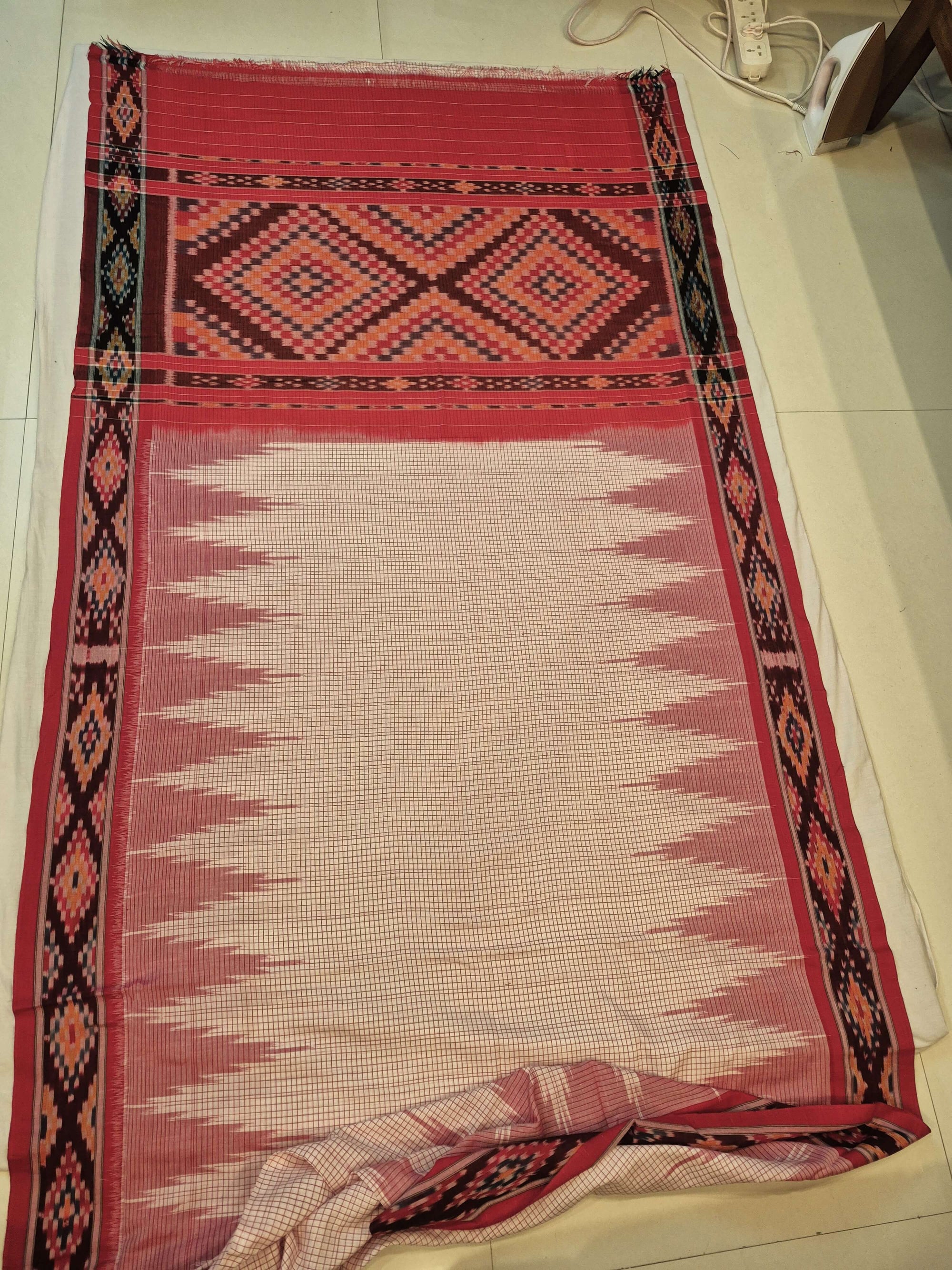 Beige Checkered body Cotton Odisha Ikat saree with cotton ikat blouse piece