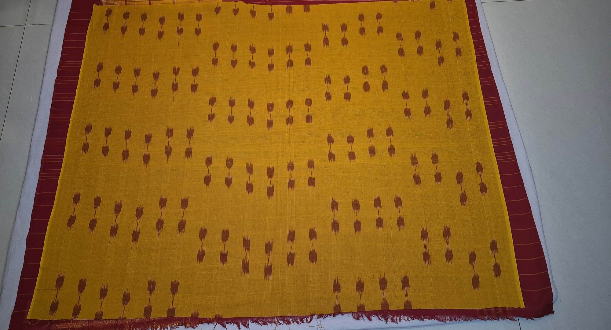 Maroon Golden Cotton Odisha Ikat saree with cotton ikat blouse piece