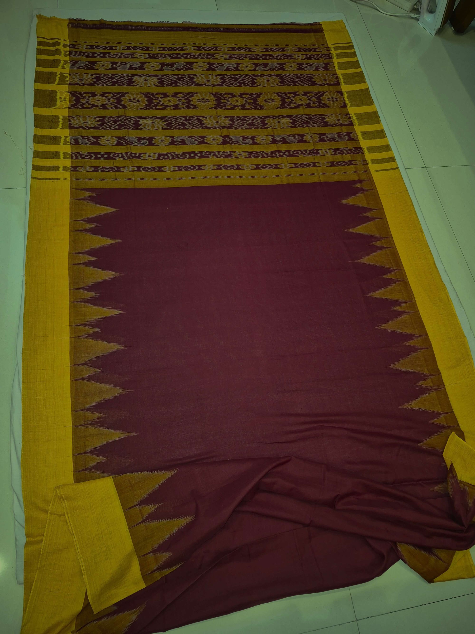 Maroon Golden Cotton Odisha Ikat saree with cotton ikat blouse piece