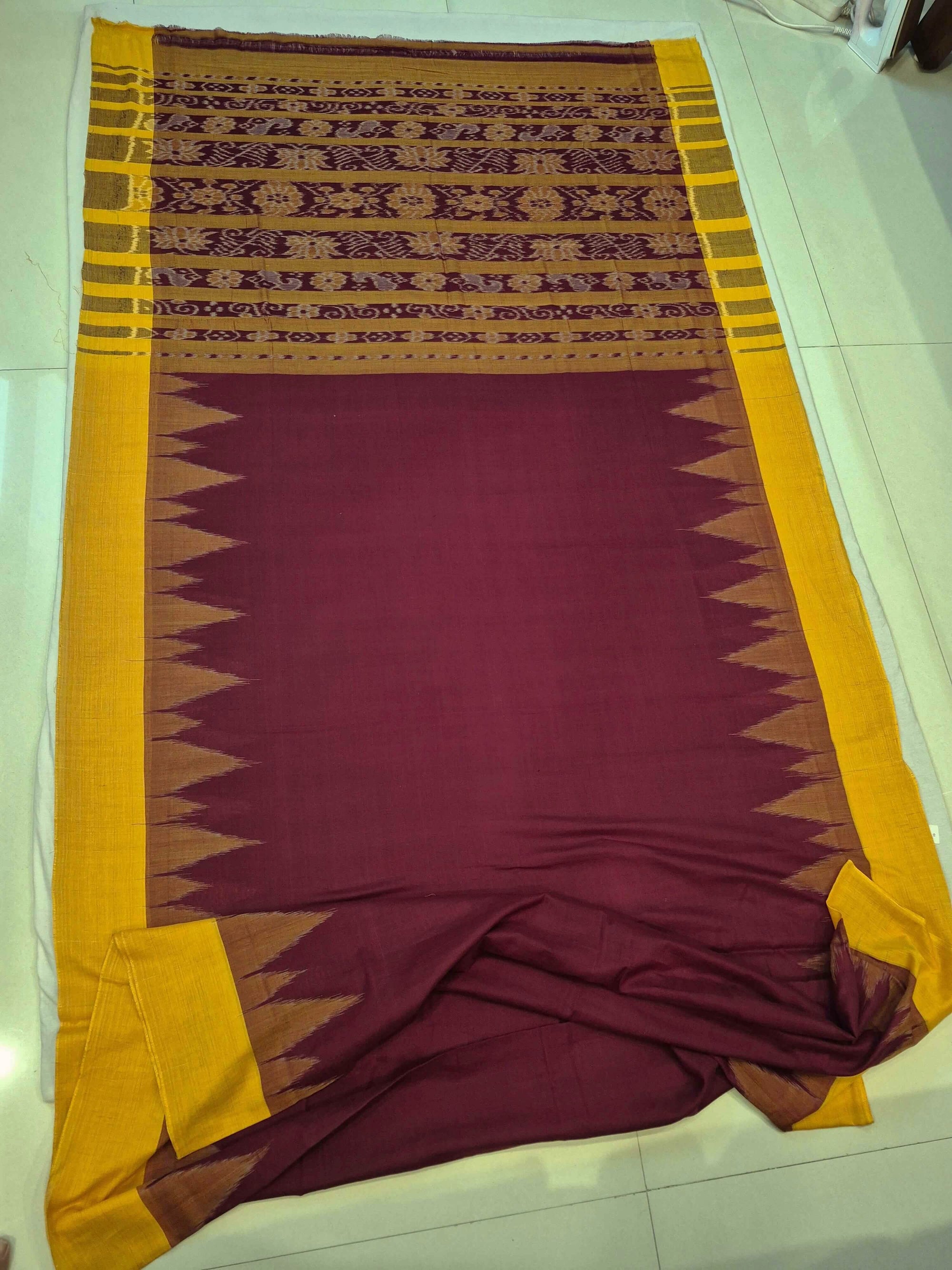 Maroon Golden Cotton Odisha Ikat saree with cotton ikat blouse piece