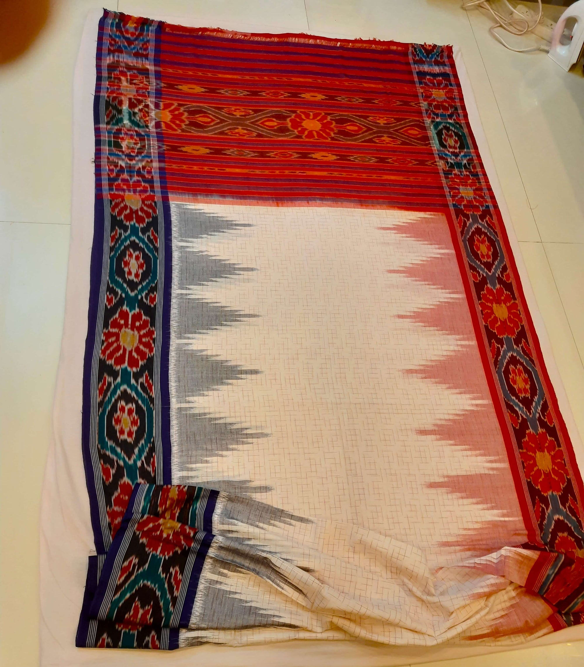 White Ganga Jamuna border Cotton Odisha Ikat saree with cotton ikat blouse piece
