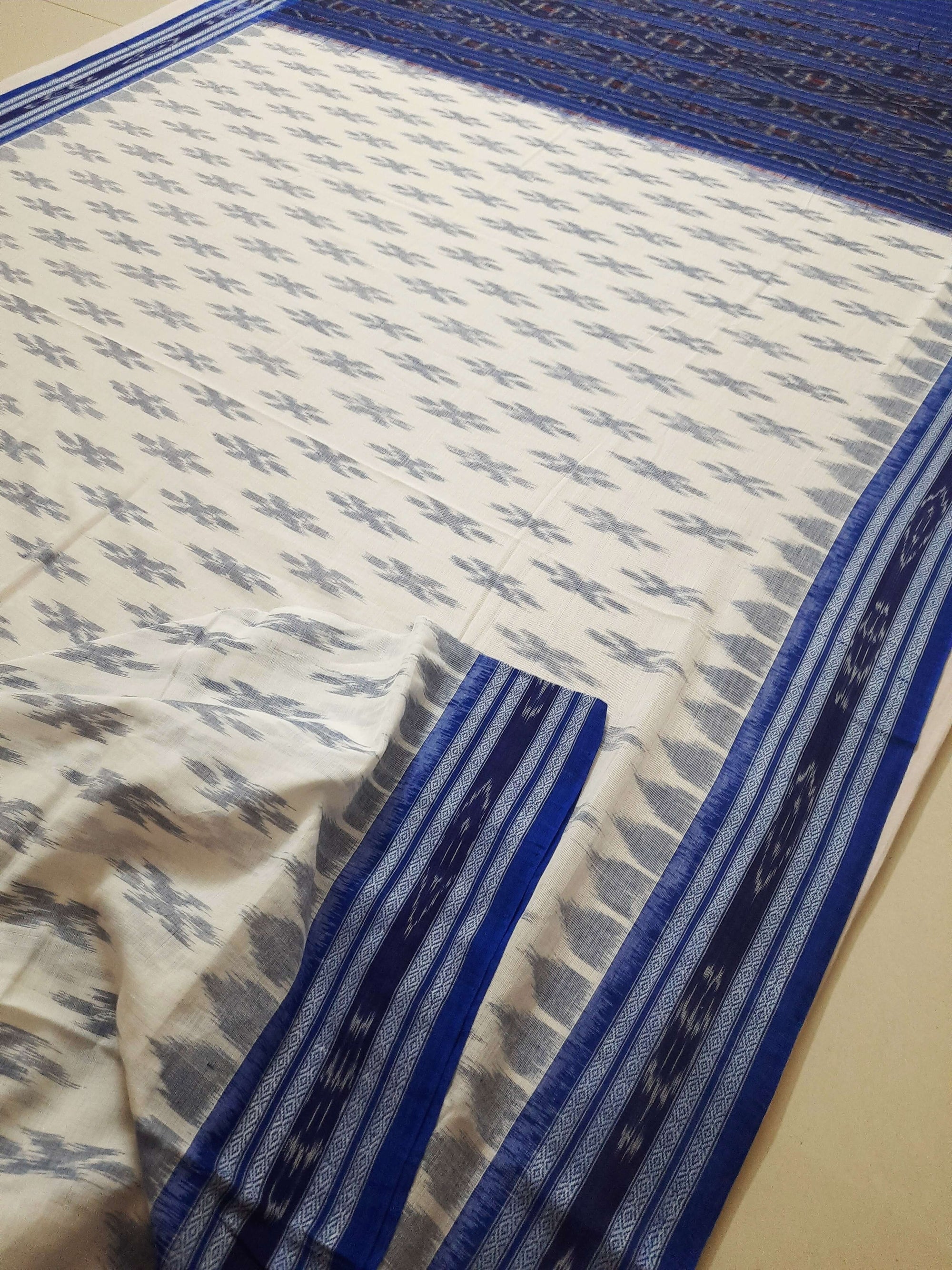 White with Blue Cotton Odisha Ikat saree with cotton ikat blouse piece