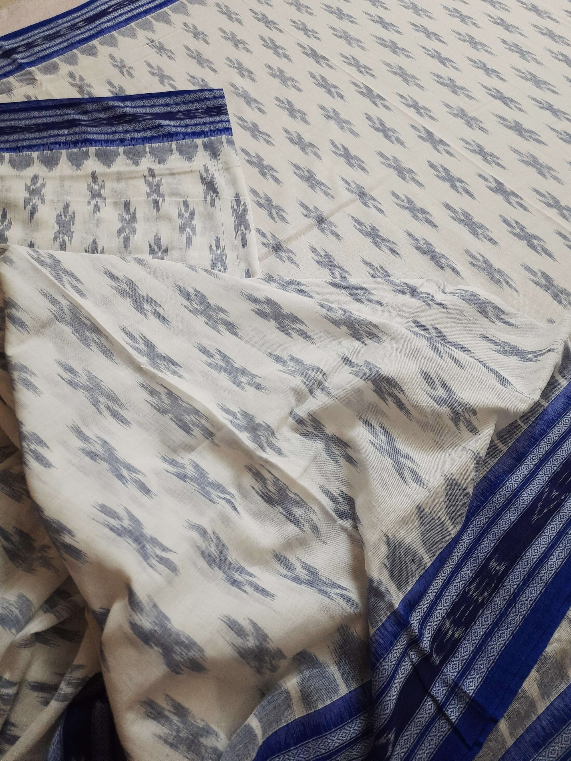 White with Blue Cotton Odisha Ikat saree with cotton ikat blouse piece
