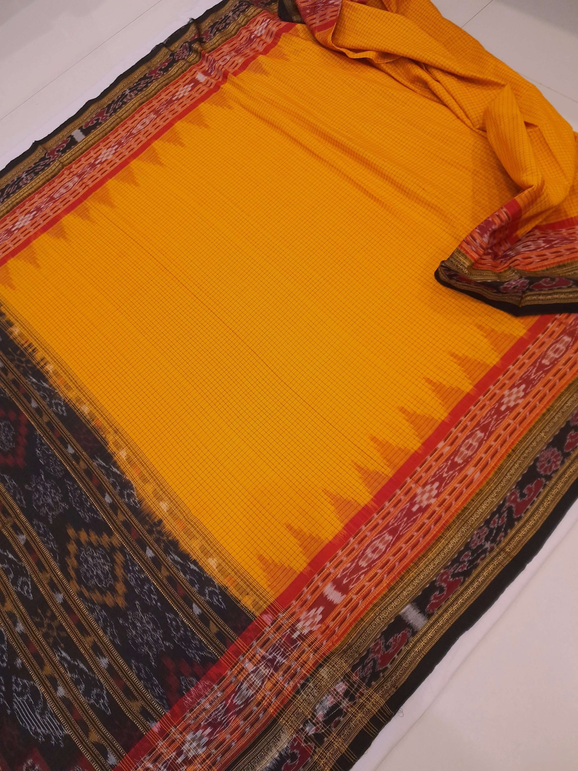 Yellow double order Sachipar Nuapatna Cotton Ikat saree with cotton ikat blouse piece