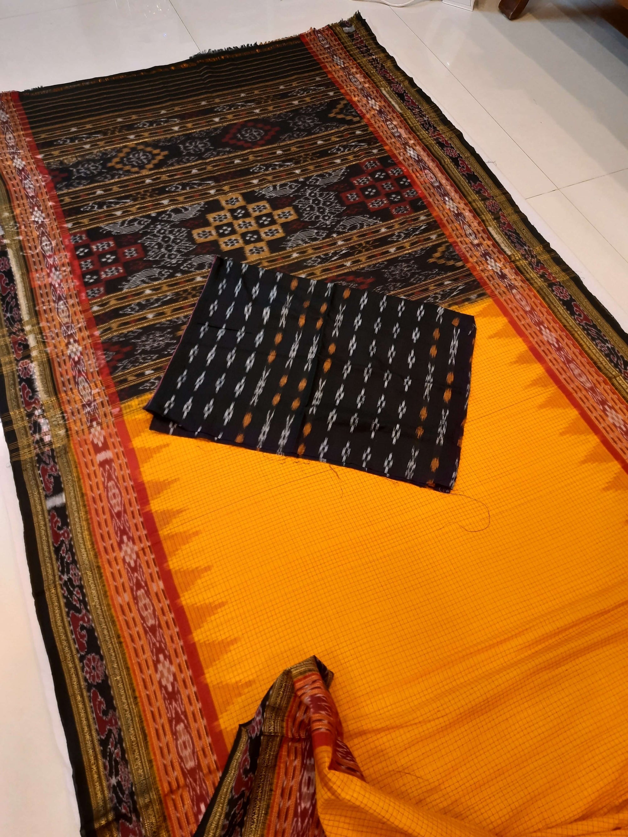Yellow double order Sachipar Nuapatna Cotton Ikat saree with cotton ikat blouse piece