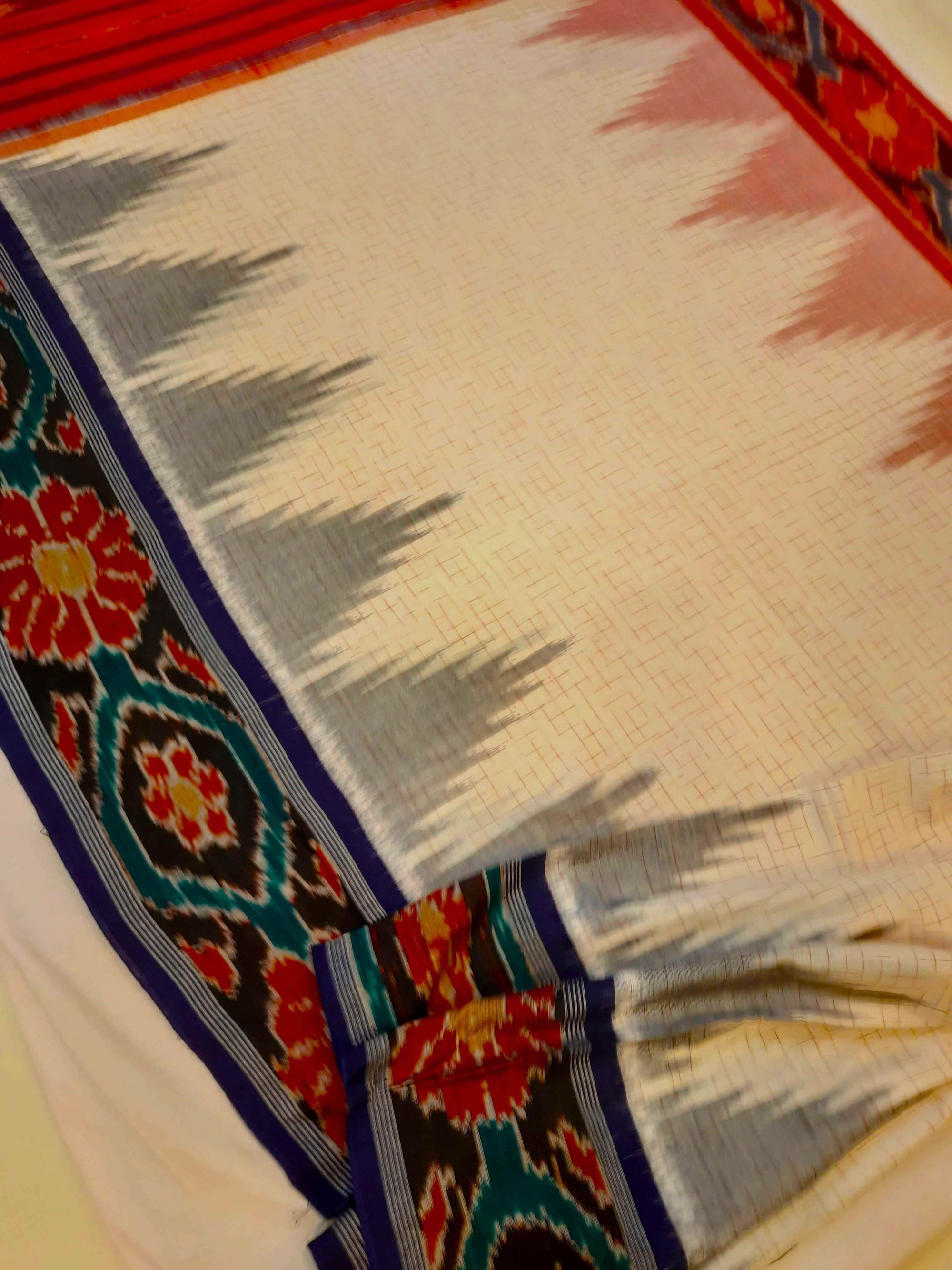 White Ganga Jamuna border Cotton Odisha Ikat saree with cotton ikat blouse piece