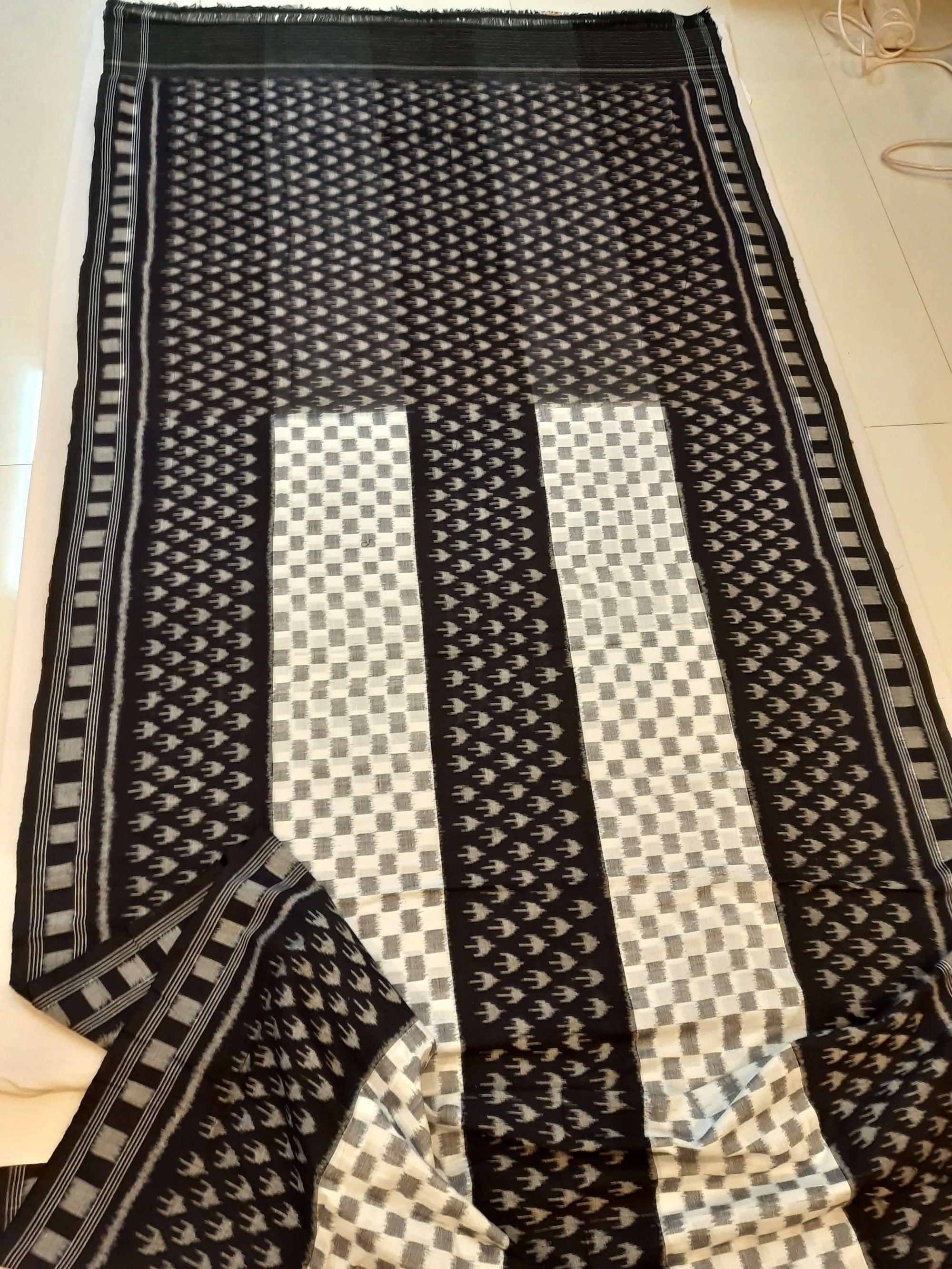 White and Black Cotton Ikat saree with cotton ikat blouse piece