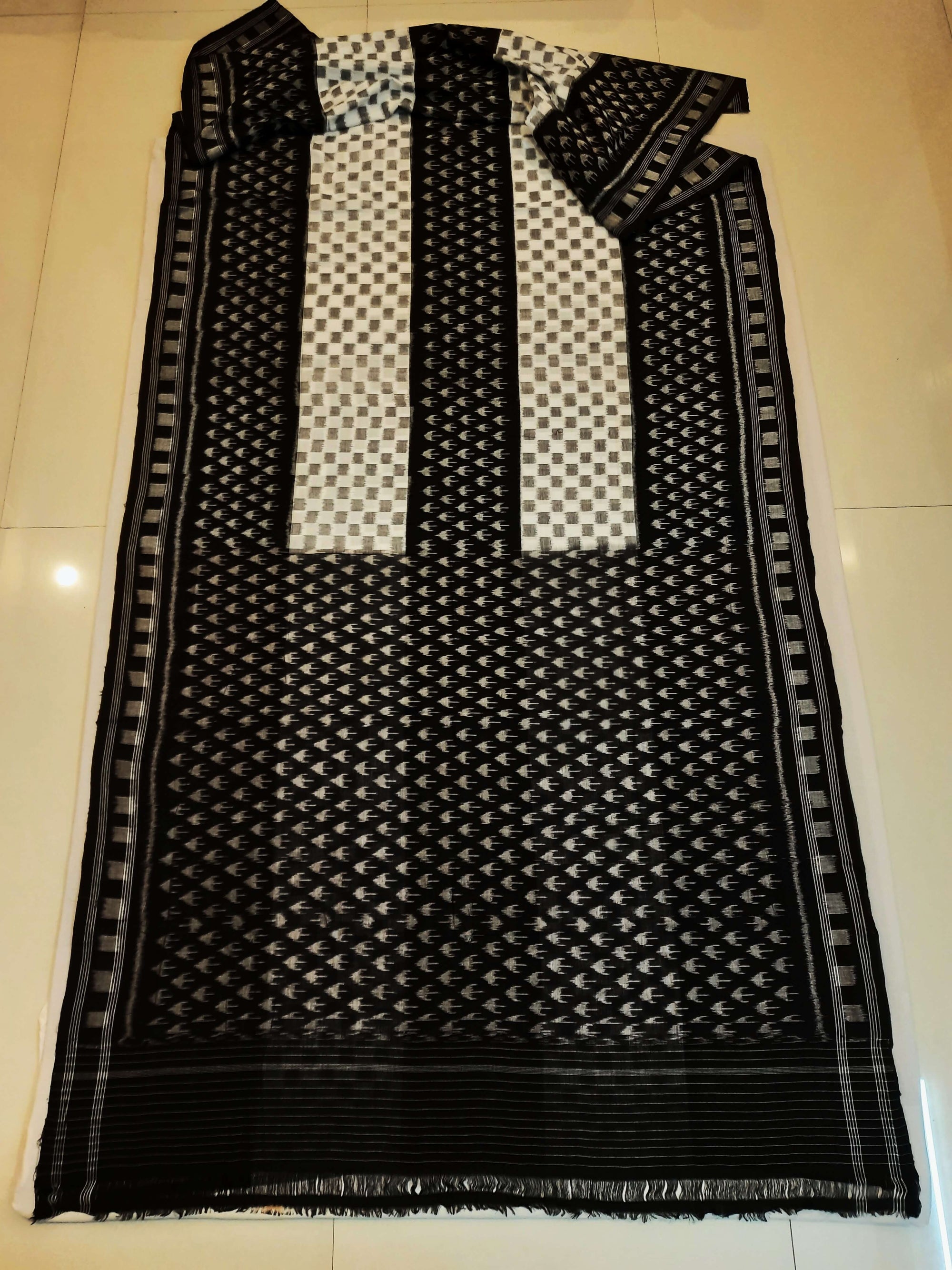 White and Black Cotton Ikat saree with cotton ikat blouse piece