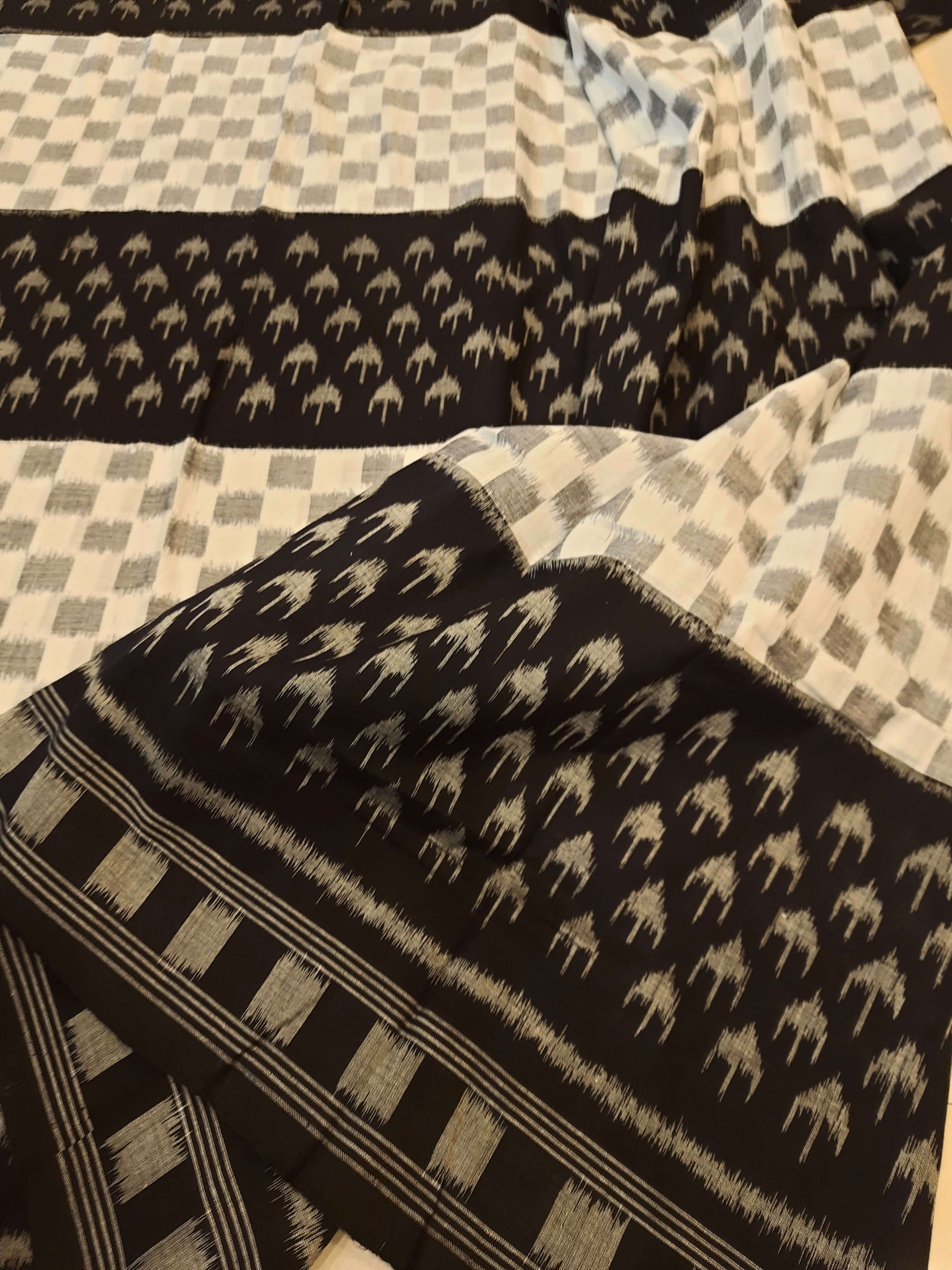 White and Black Cotton Ikat saree with cotton ikat blouse piece