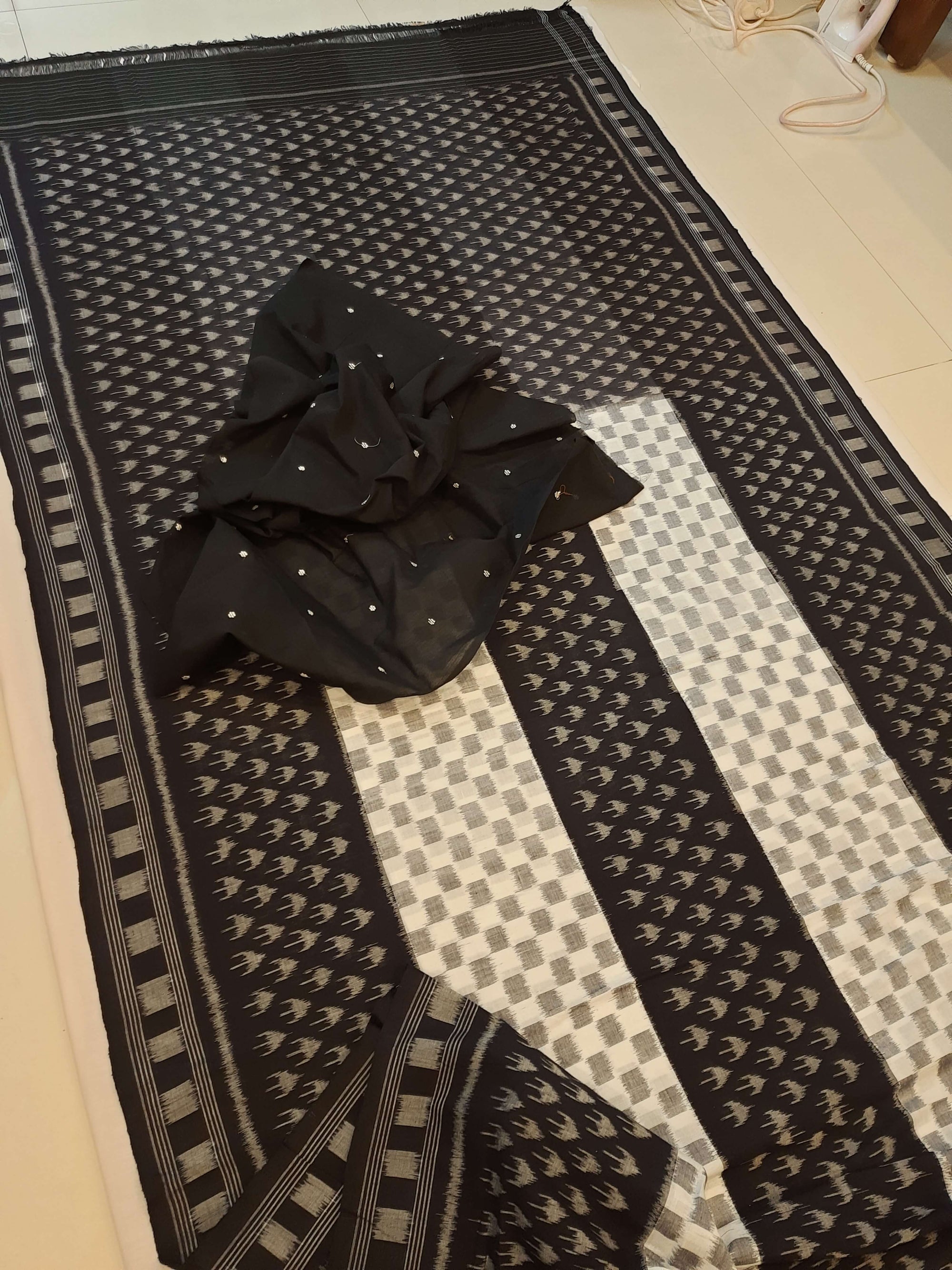 White and Black Cotton Ikat saree with cotton ikat blouse piece