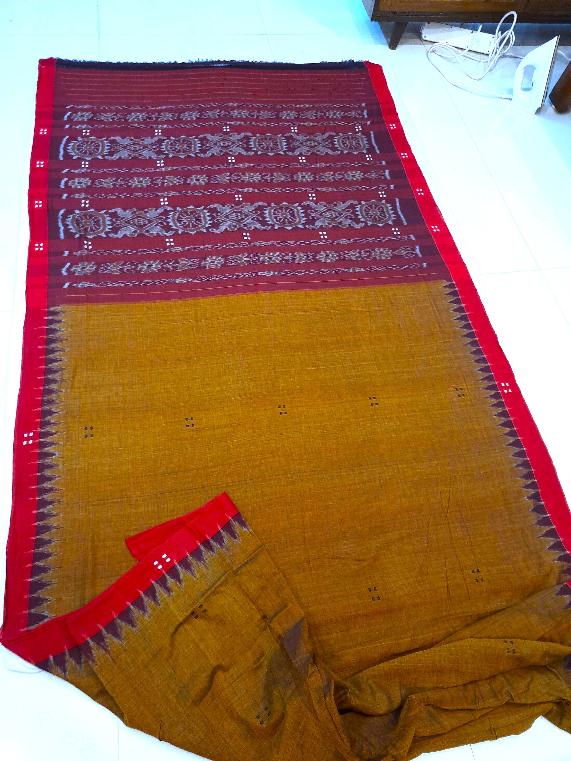 Mustard Brown Cotton Odisha Ikat saree paired with cotton ikat blouse piece