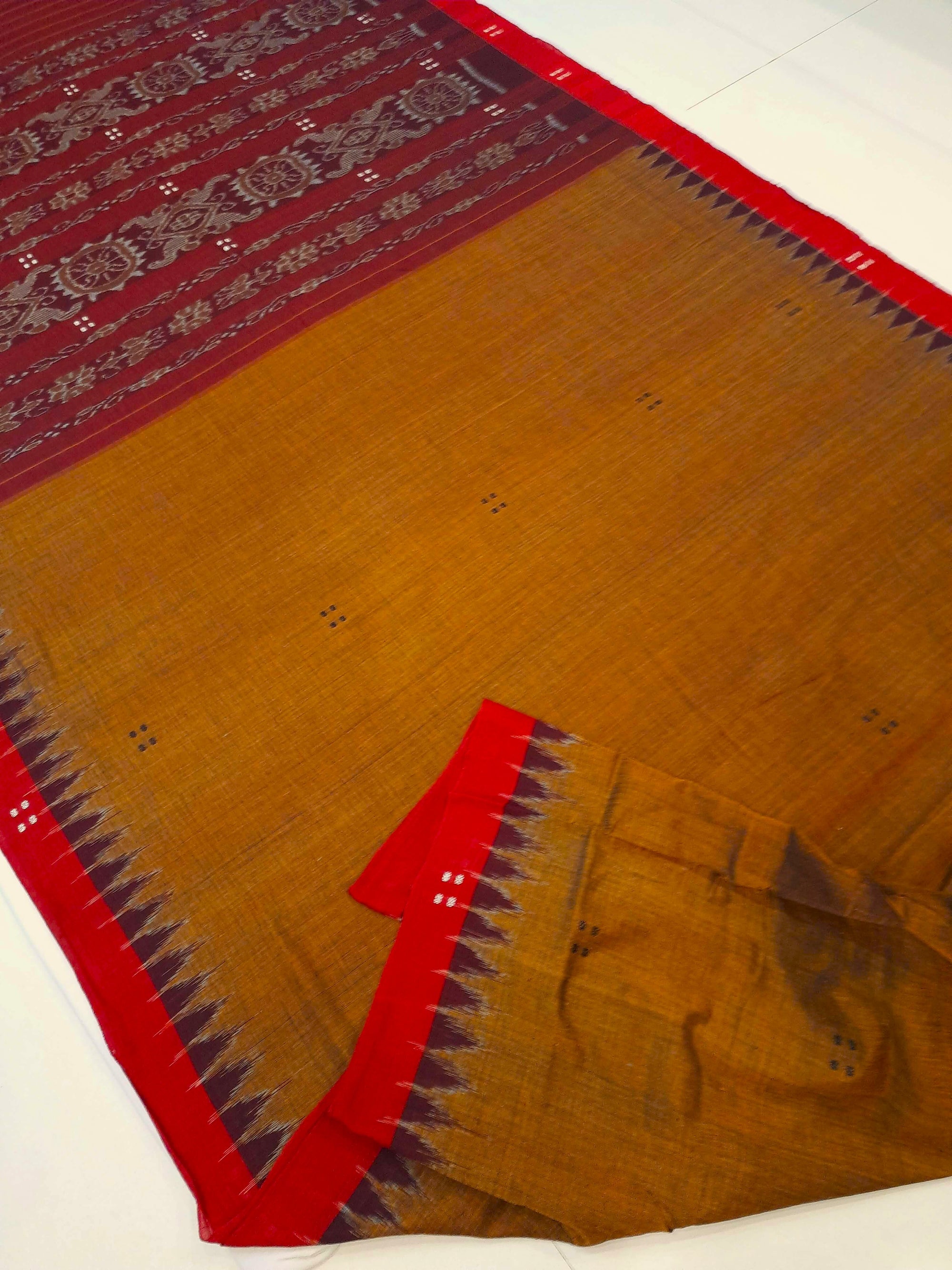 Mustard Brown Cotton Odisha Ikat saree paired with cotton ikat blouse piece