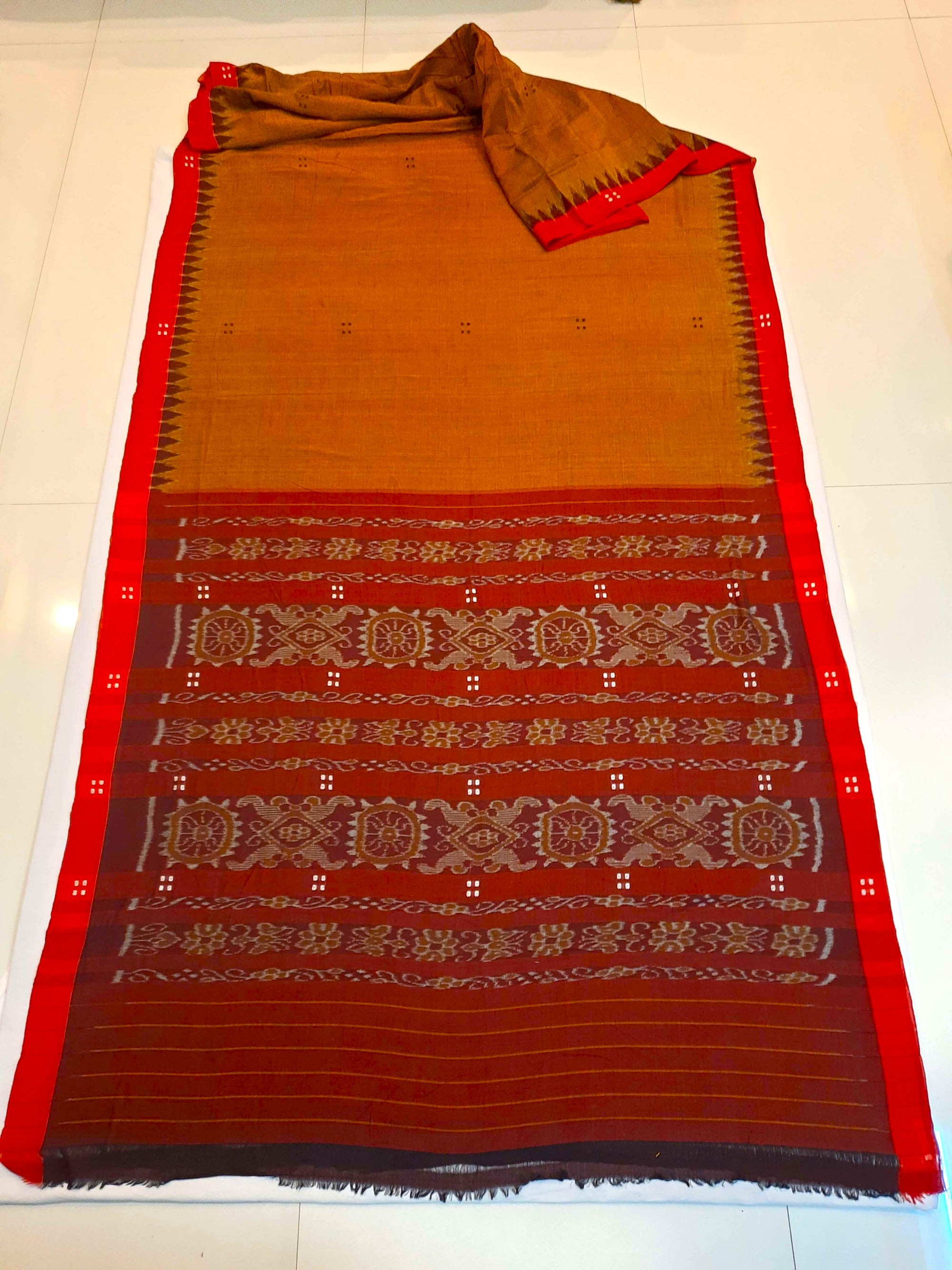 Mustard Brown Cotton Odisha Ikat saree paired with cotton ikat blouse piece