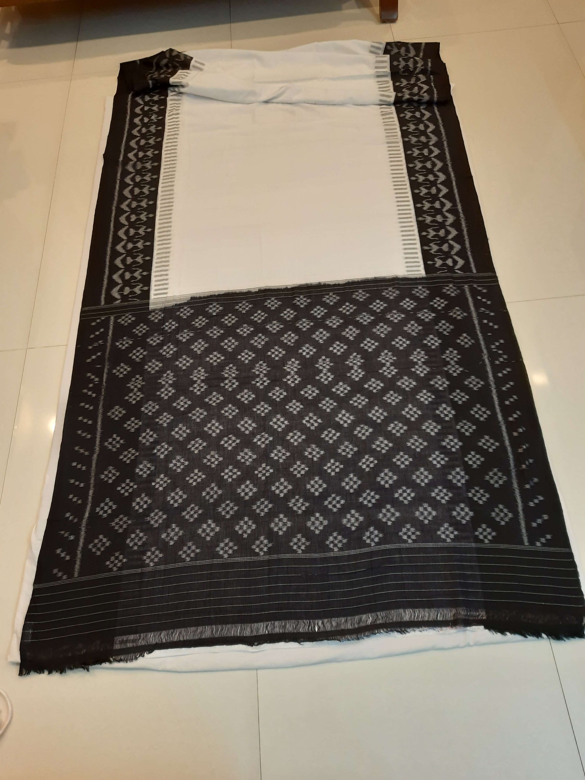 White and Black Cotton Ikat saree with cotton ikat blouse piece