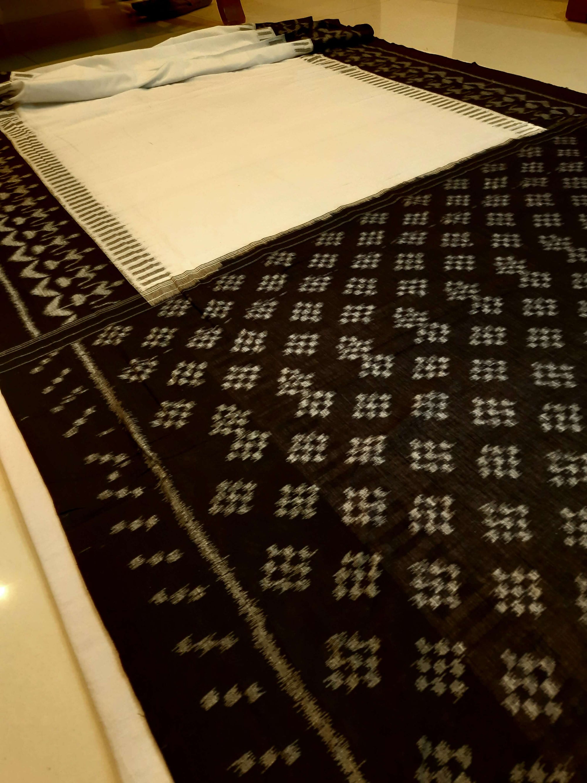White and Black Cotton Ikat saree with cotton ikat blouse piece