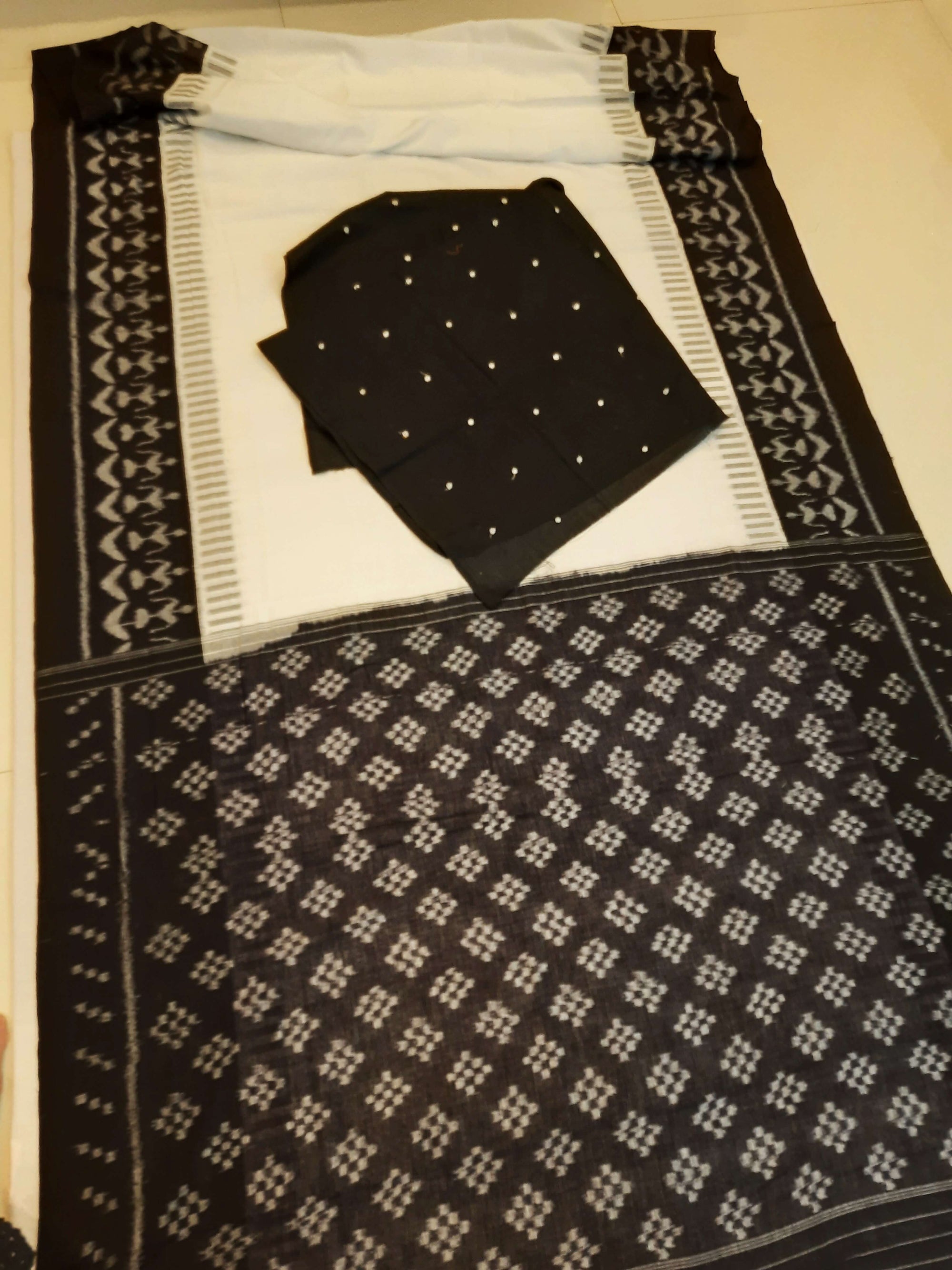 White and Black Cotton Ikat saree with cotton ikat blouse piece