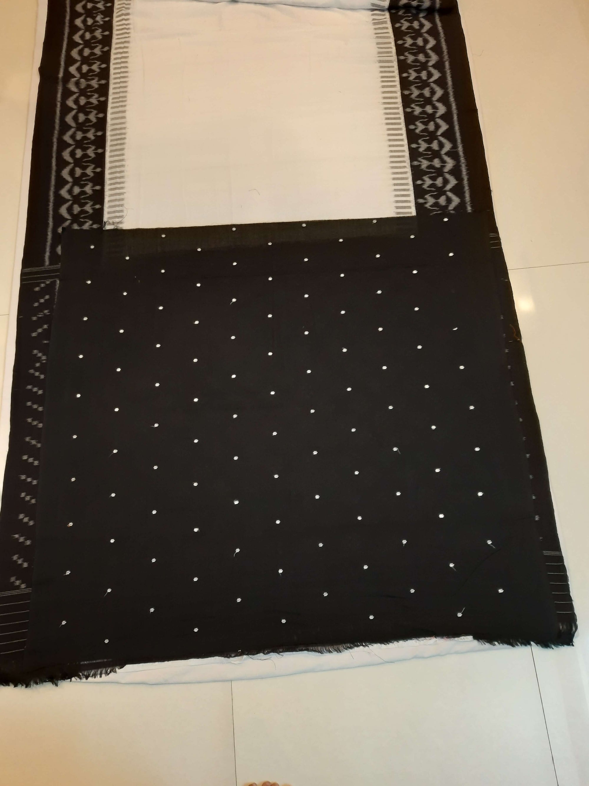 White and Black Cotton Ikat saree with cotton ikat blouse piece