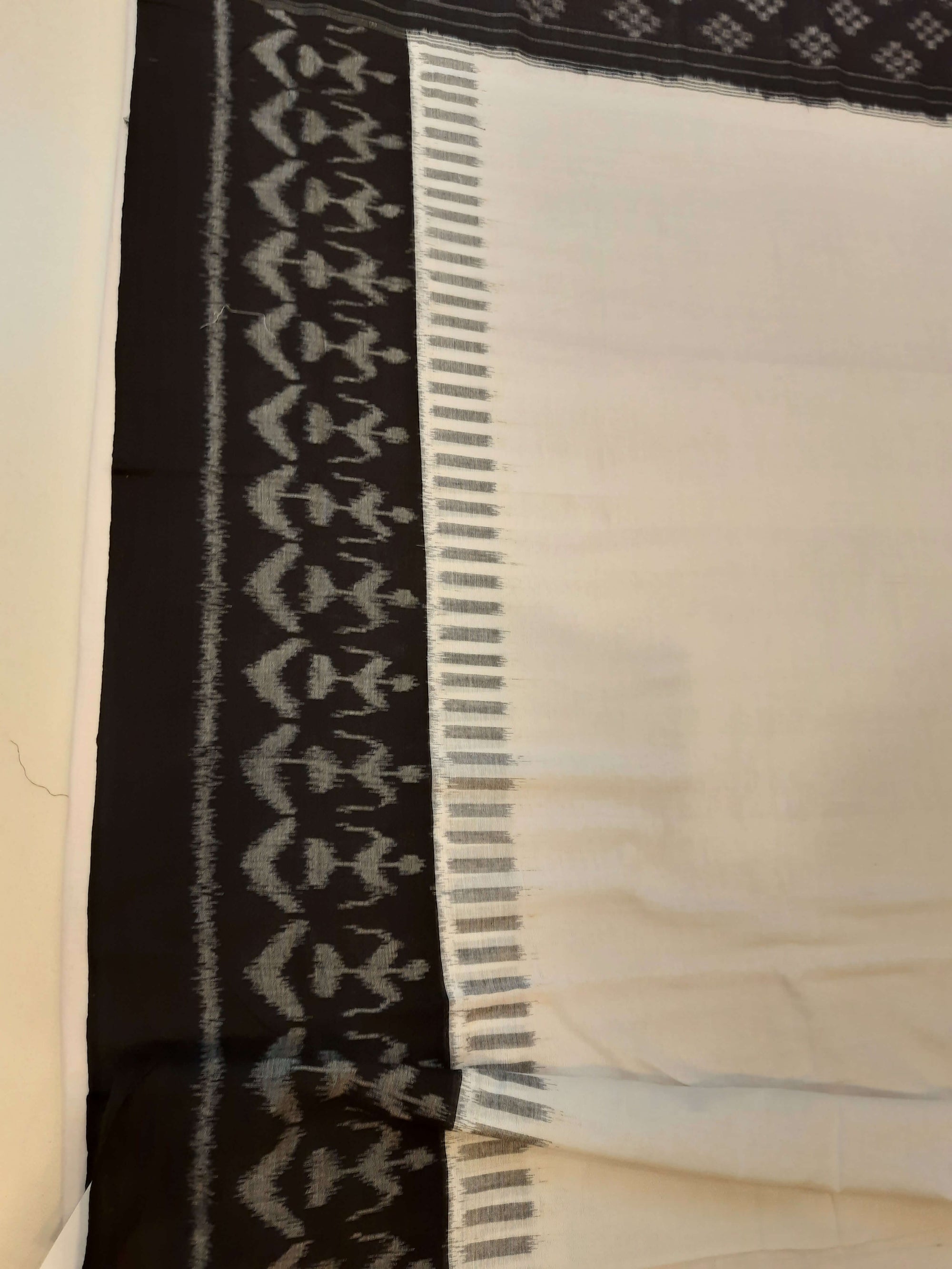 White and Black Cotton Ikat saree with cotton ikat blouse piece