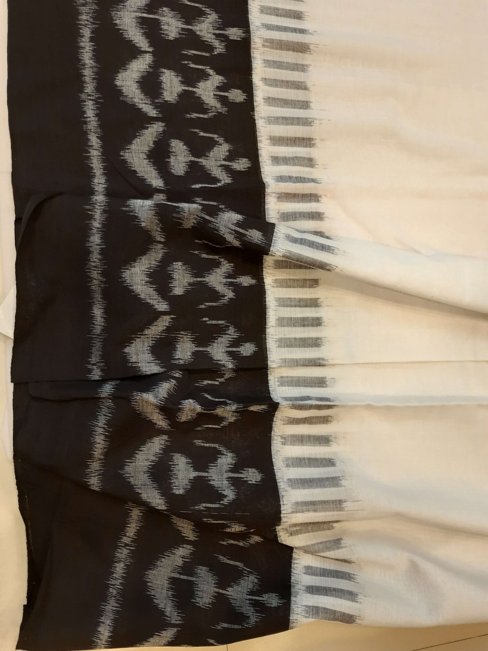 White and Black Cotton Ikat saree with cotton ikat blouse piece