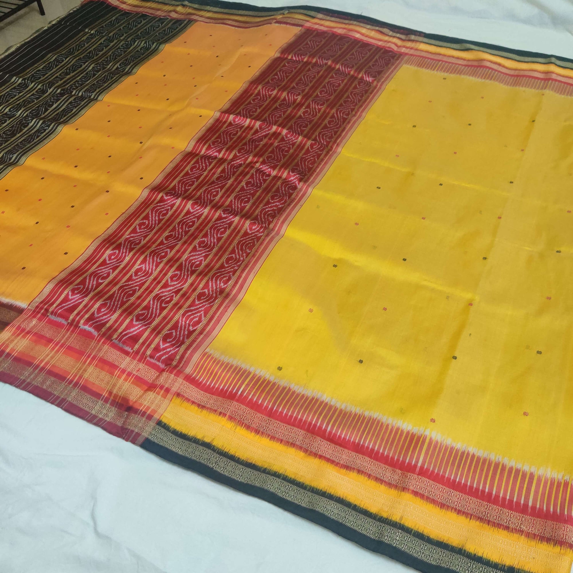 Yellow Kathiphera Odisha Ikat Silk Saree with black blouse piece
