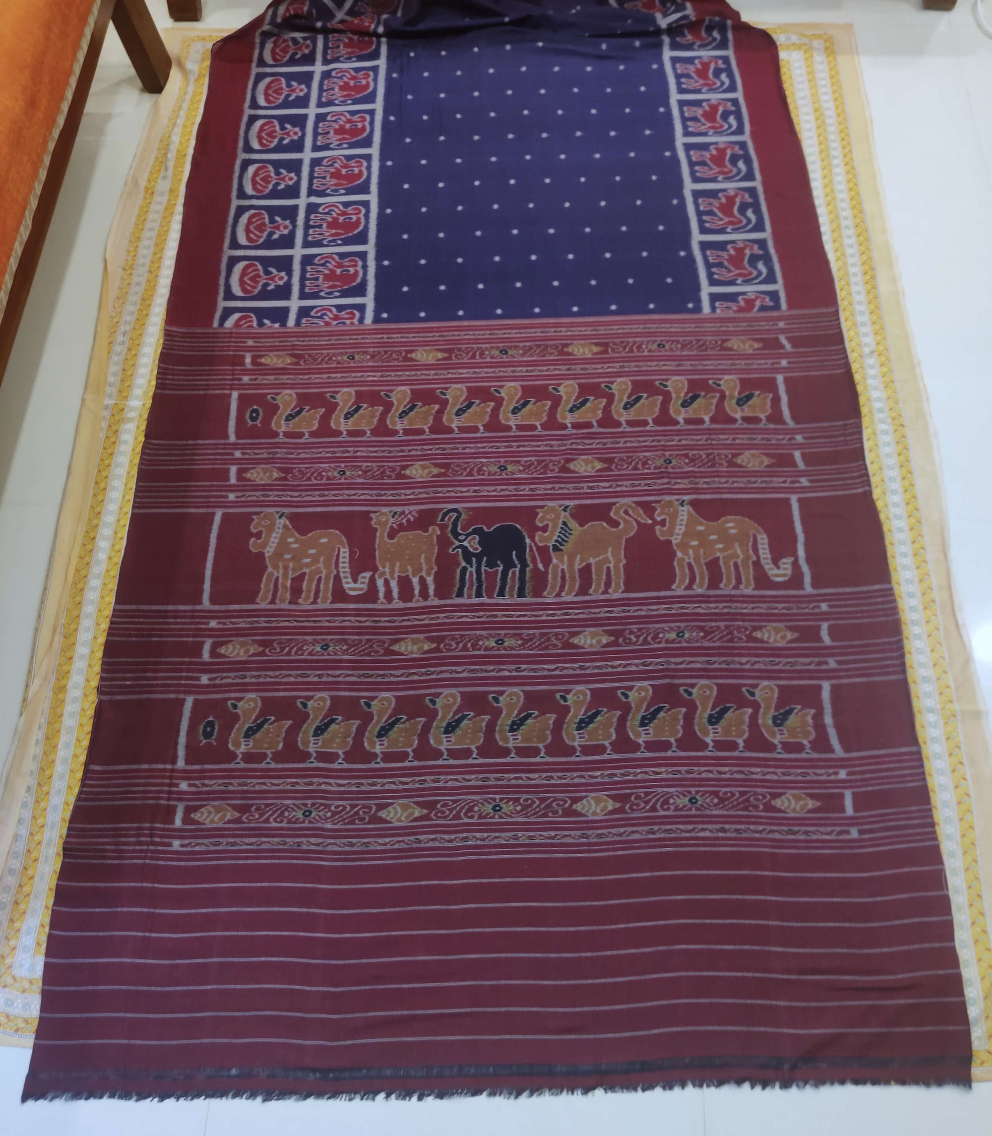 Blue cotton Odisha Ikat saree with elephant motifs in wide border