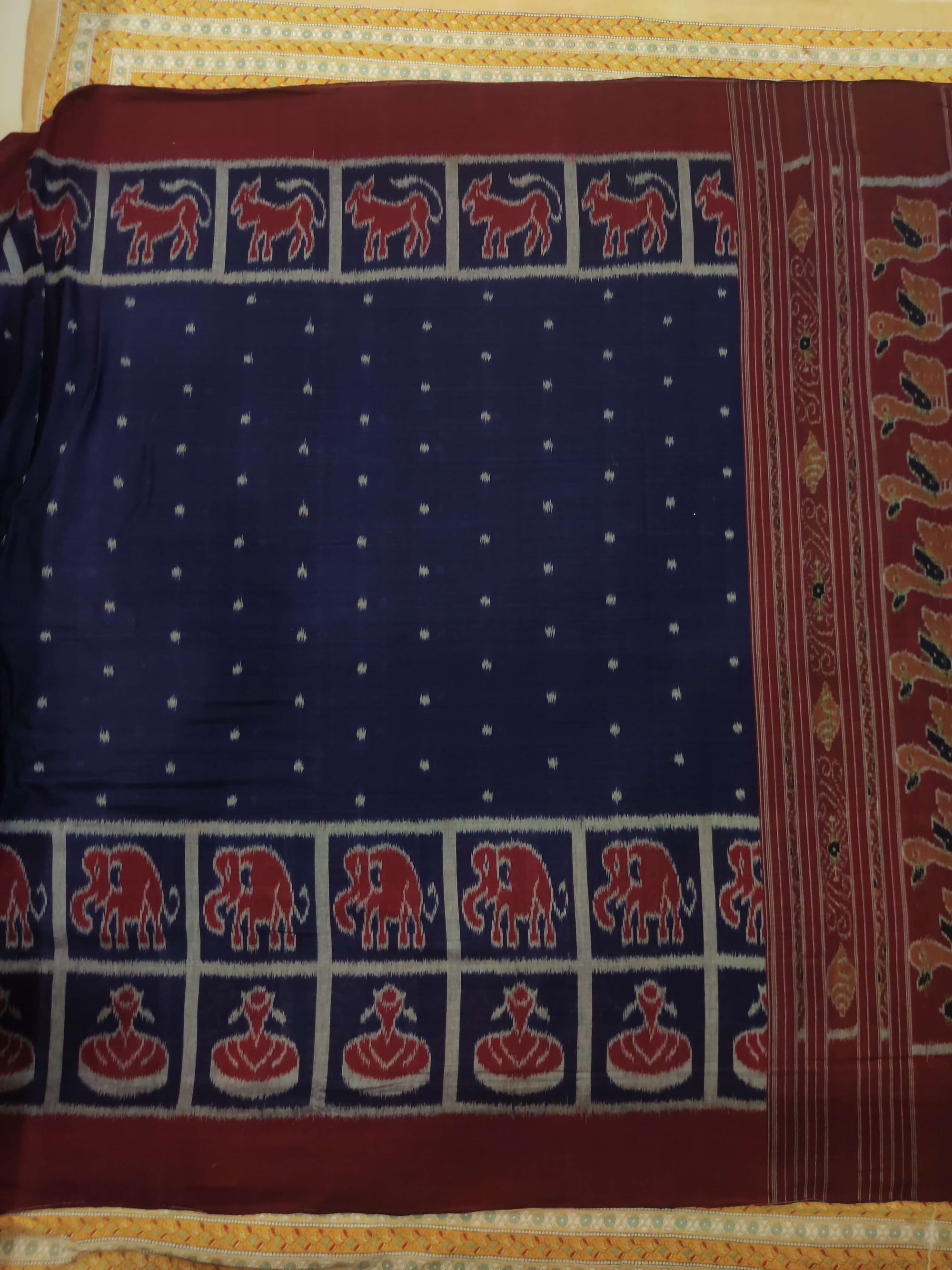 Blue cotton Odisha Ikat saree with elephant motifs in wide border